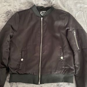Black comfy jacket. Looks great with almost every outfit adding a nice touch.